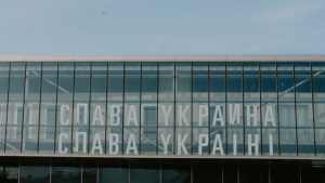 a large glass building with a sky background